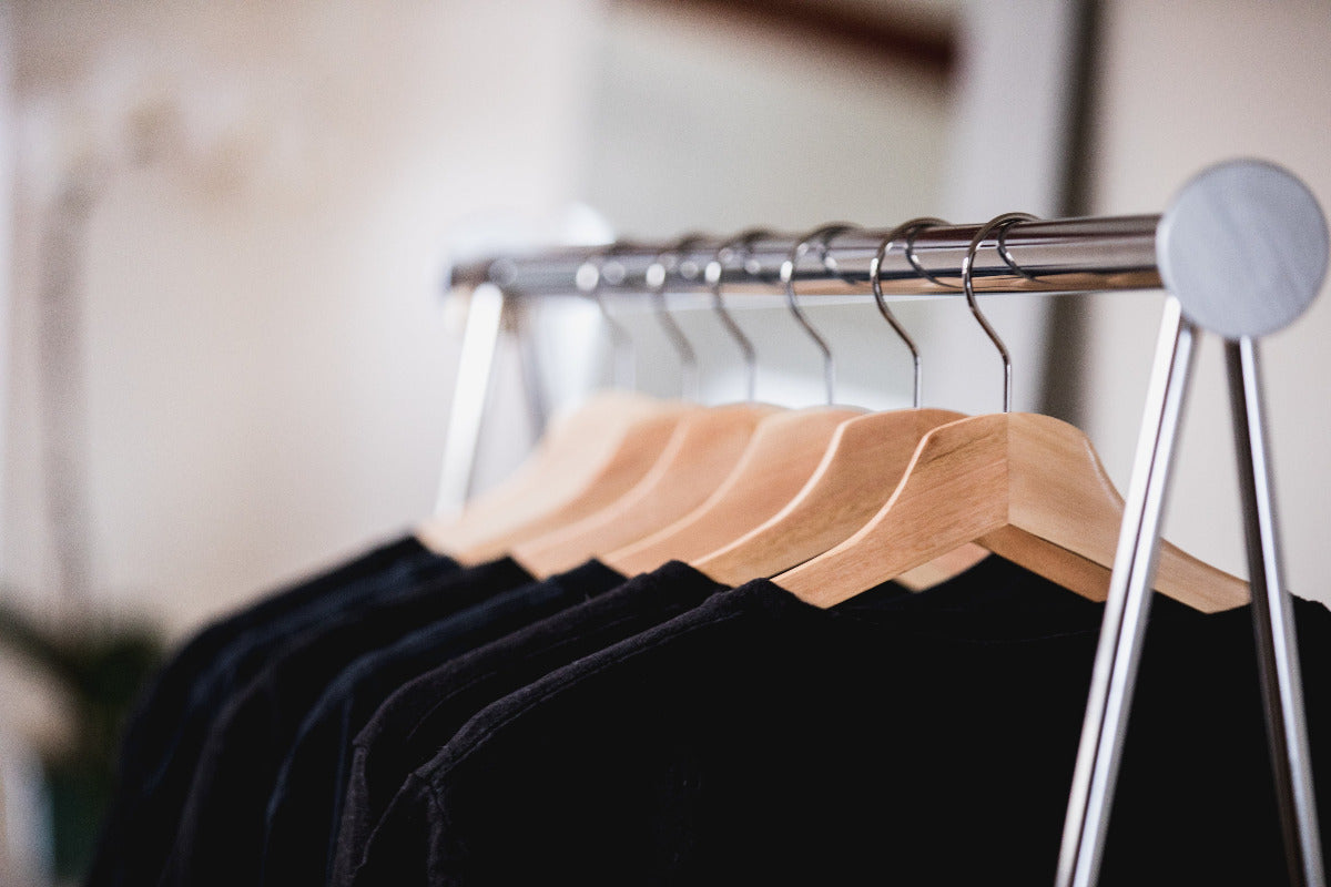 Black T Shirts hanging on a rack